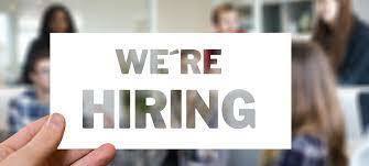 white card with "We're Hiring!" written on it